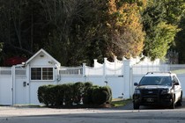 A car sits outside the home of Bill and Hillary Clinton in Chappaqua, New York.