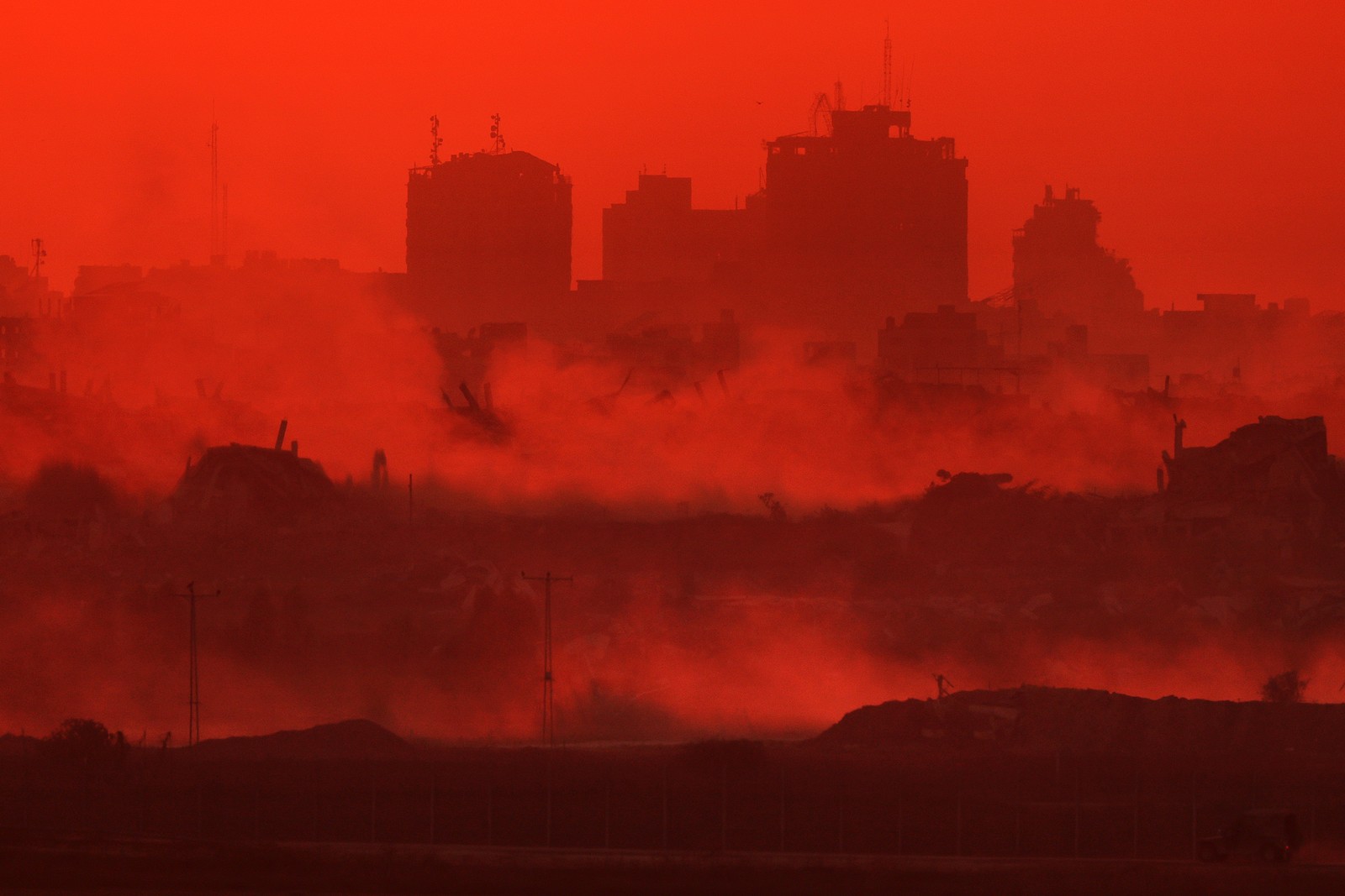 Destroyed buildings in the Gaza Strip are pictured at sunset.