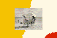 A black and white photo shows a white couple siting in folding chairs on the beach, facing one another and sharing the shade of a single umbrella.