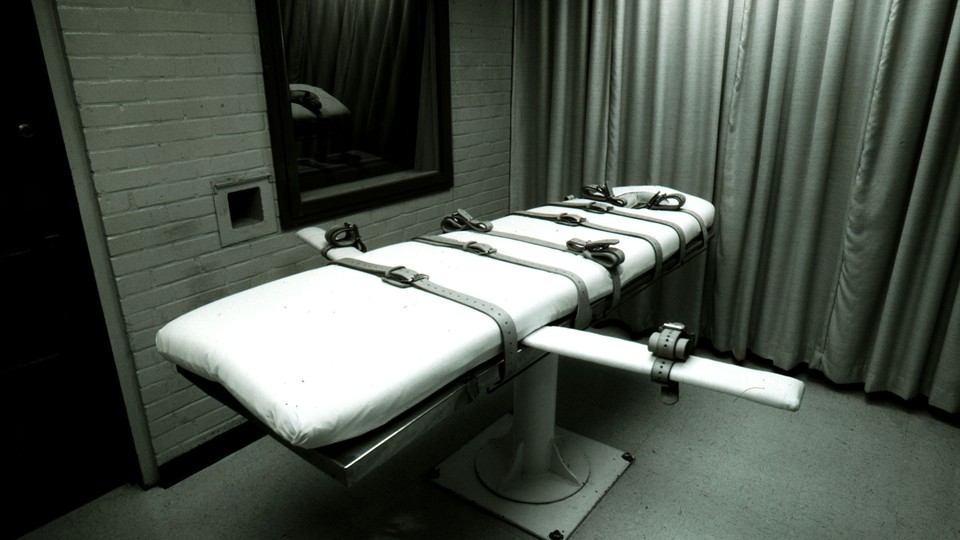 A photograph of a bed in an execution chamber.