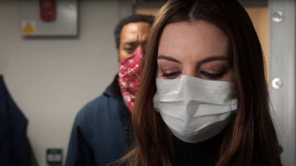Anne Hathaway and Chiwetel Ejiofor wearing masks in the movie 'Locked Down'