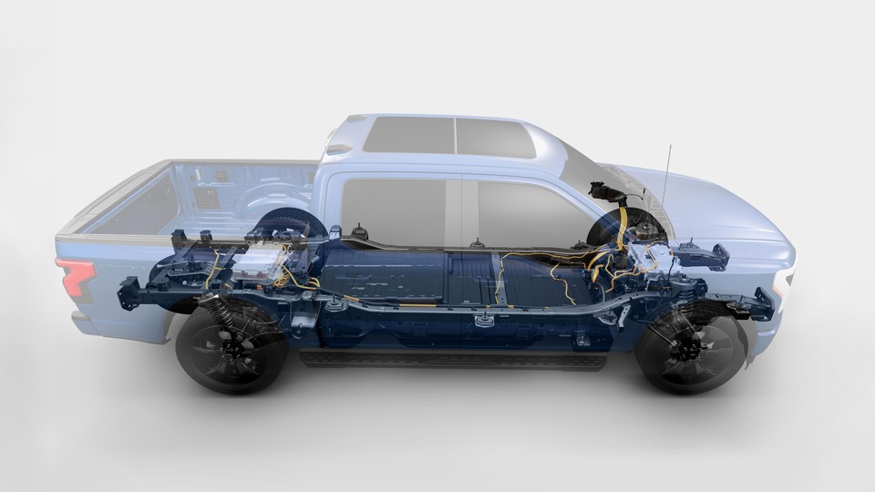 A double-exposure image of the motor and exterior of a Ford F-150