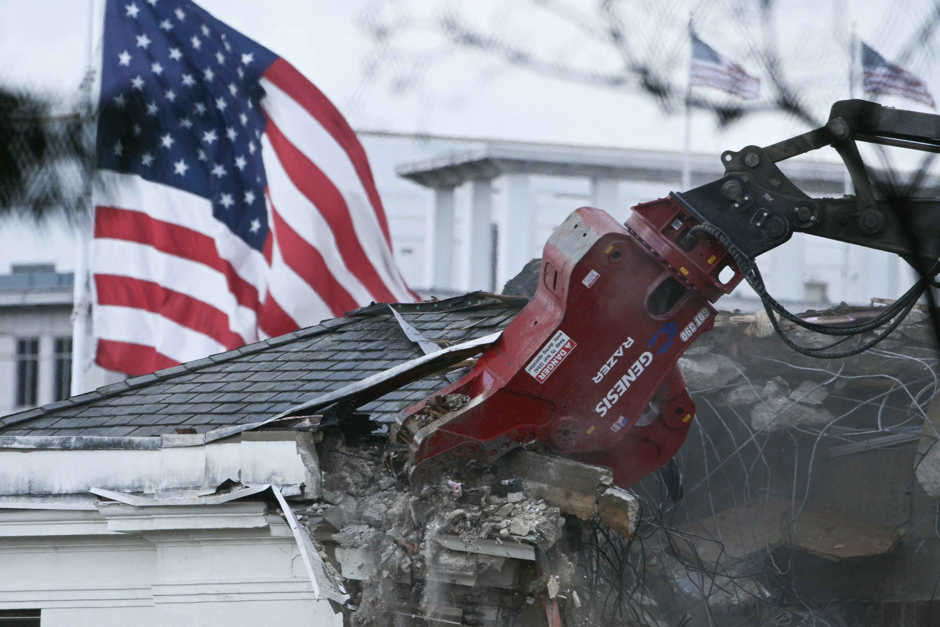 Heavy machinery tears down a section of the East Wing of the White House.