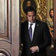 Florida Senator Marco Rubio walks through a doorway.