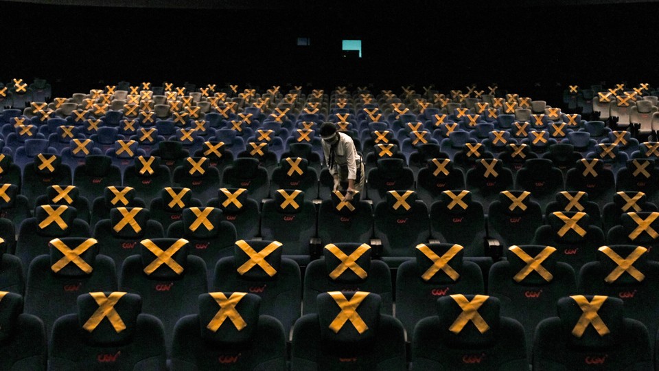 A mostly empty movie theater with one lone viewer in Jakarta, Indonesia