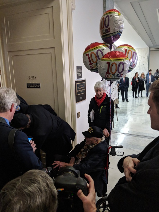 A WWII veteran celebrating his 100th birthday at Michael Cohen's hearing