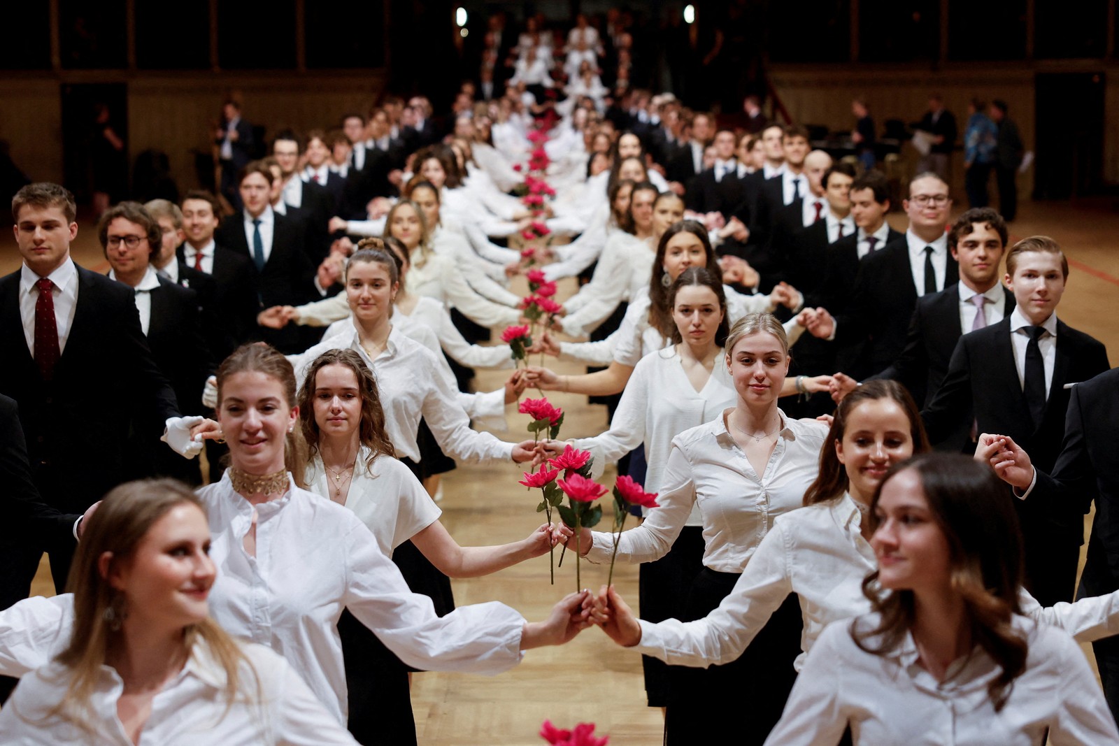Young men and women perform during a dress rehearsal for a traditional Opera Ball.