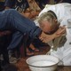 Pope Francis washing a man's feet