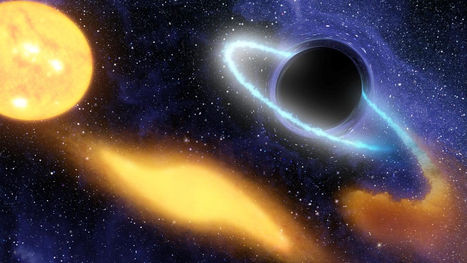 An illustration of a supermassive black hole digesting the remnants of a star