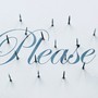 The word "please" in cursive script on a white background, pierced by nails poking through