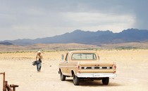 A still showing the Western landscape and a truck in the film "No Country for Old Men"