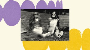 A black-and-white photograph is set on a cream-colored background. The background has rows of purple circles that look like they are curving away and rows of yellow circles that look like they are curving in the other direction. The photo shows two women in their 20s sitting on a grassy hill but the image is glitchy like the screen is malfunctioning, giving the sense of an error.
