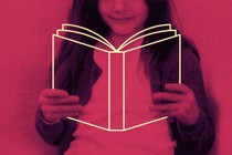 a child holds the outline of a book