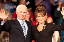 a still from the movie 'Game Change,' with a waving Ed Harris, left, as John McCain, and Julianne Moore as Sarah Palin, right