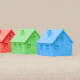 Gif of houses in a row that keeps expanding as the houses swap colors with one another