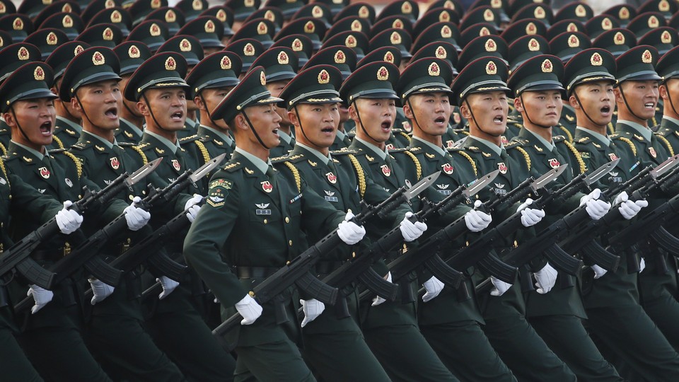 Chinese soldiers rehearse for a military parade