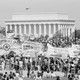 With the Lincoln Memorial in the background, anti-war marchers cross the Memorial Bridge.