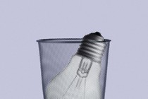 A lightbulb in a trash can