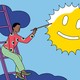 A woman paints a smiley face onto the sun