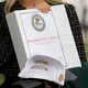 Image showing a binder that reads "The Epstein Files: Phase 1"