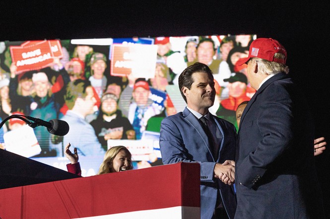 Picture of Matt Gaetz shaking hands with former U.S. President Donald Trump during a rally at the Banks County Dragway on March 26, 2022 in Commerce, Georgia.