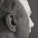 An older man's profile from behind