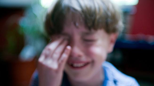 A young boy crying