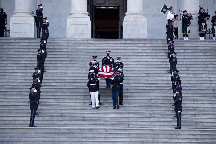 A flag-draped casket is carried down the Capitol steps.