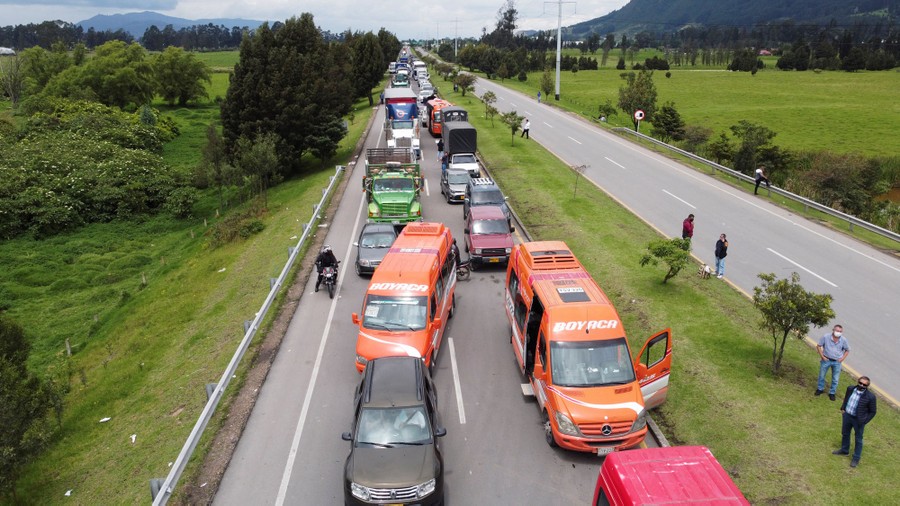 Dozens of cars sit stranded on a highway.