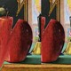 Illustration of a distorted apple on a teacher's desk in an old-fashioned schoolroom.