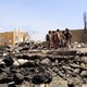 People stand at the scene of an air strike in Saada, Yemen on March 28, 2019.