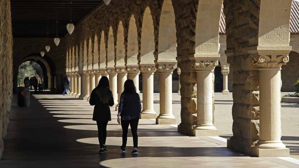 students walking on Stanford University's campus