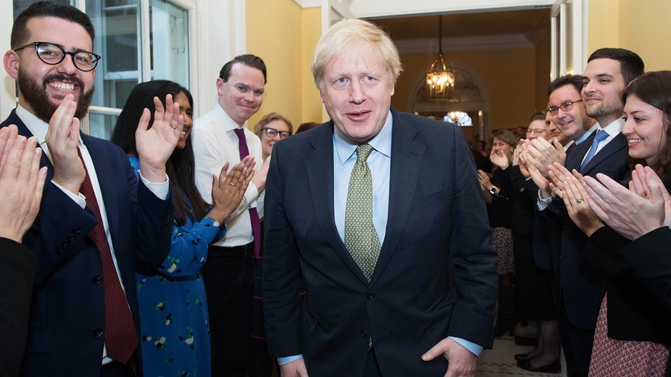 Boris Johnson arrives back at 10 Downing Street after visiting Buckingham Palace where he was given permission to form the next government during an audience with Queen Elizabeth II on December 13, 2019 in London, England