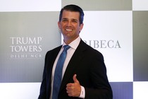 Donald Trump Jr. smiles and flashes a thumbs-up 