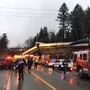 Firefighters and police on the scene of a trail derailment