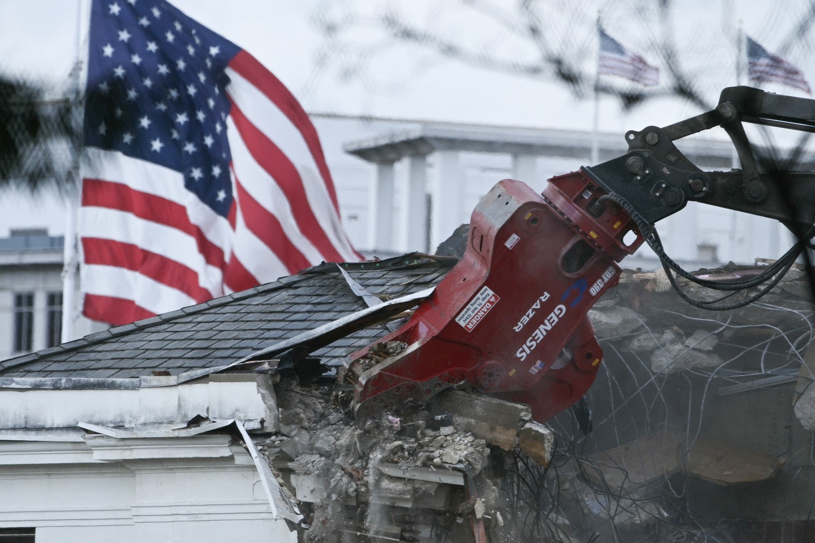 Heavy machinery tears down a section of the East Wing of the White House.