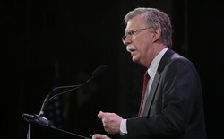 John Bolton speaks at a microphone.