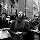 Occupy Wall Street protesters stand in a row with their arms linked
