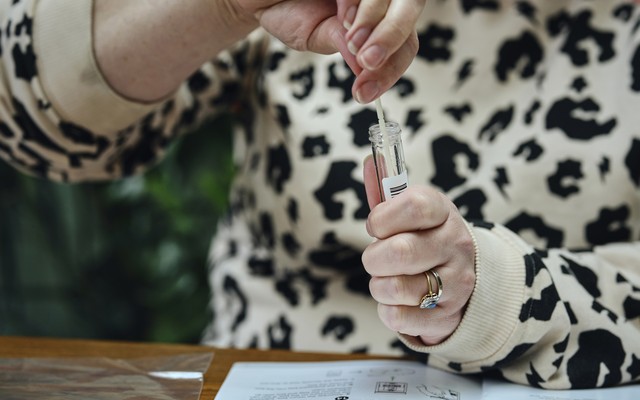a woman uses a coronavirus test