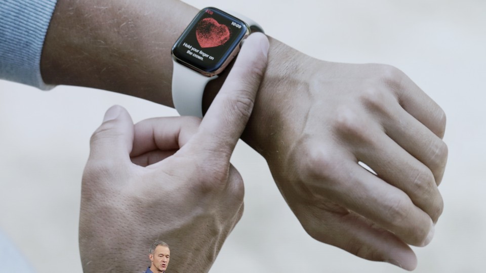 A finger rests on the latest Apple Watch