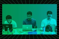 A group of computer science students on their laptops