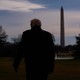 trump's back with washington memorial in the background