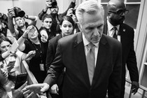 Republican House leader Kevin McCarthy surrounded by a gaggle of reporters.