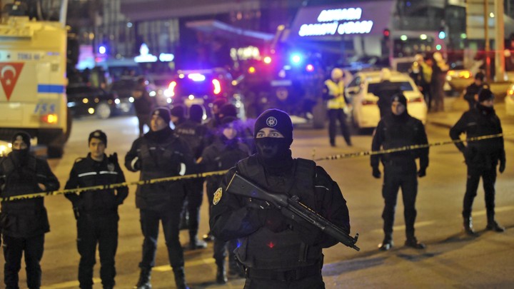 Turkish police officers cordon off the area around the gallery where Andrey Karlov was shot and killed by a gunman in Ankara on December 19, 2016.