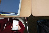 A student looking at their phone