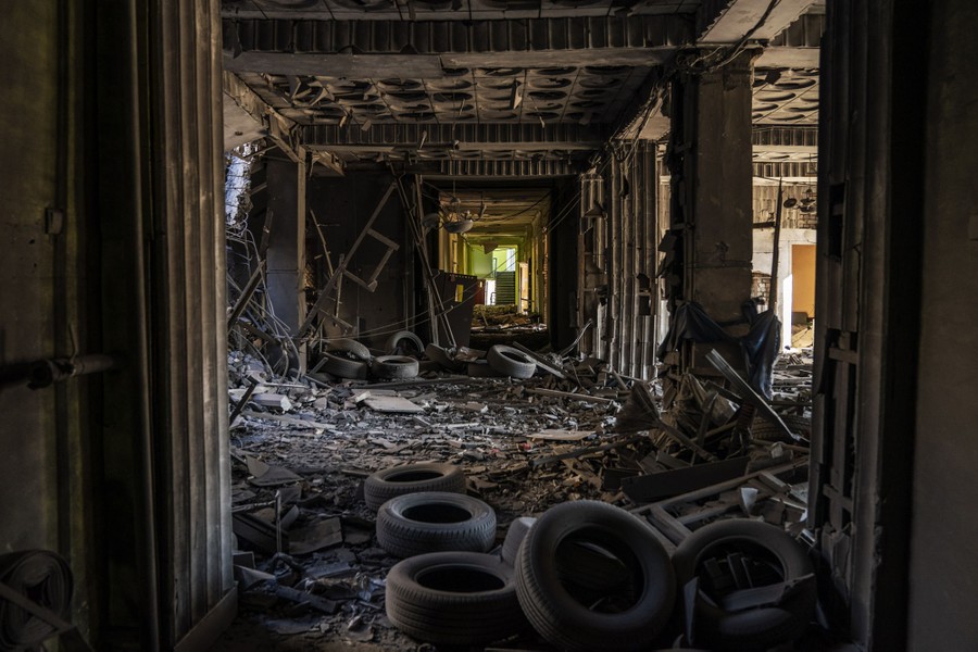 The interior of a building, filled with debris and damaged by a missile strike