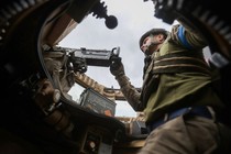 A soldier in a combat vehicle