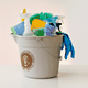 An illustration shows cleaning supplies inside a bucket with the presidential seal on it.