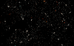 A sphere of small particles expands and contracts against a black background.