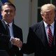 Donald Trump and Brazilian President Jair Bolsonaro shake hands after a news conference at the Rose Garden of the White House.